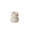 The Lyam Candleholder by Accent Decor is a small, white ceramic piece with a glossy finish and rounded, tiered shape. Featuring a white reactive glaze, it's a charming handmade decor item shown on a plain white background.