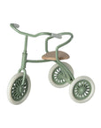 Maileg metal tricycle with wooden seat and curved handlebars, Abri a Tricycle by Maileg, perfect for playroom adventures.