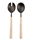 The Indaba Maple Salad Servers feature dark metal heads and light maple wood handles—one spoon, one fork with a notch—in a simple, rustic design. Perfect as unique hostess gifts for gatherings.
