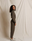 Perfectwhitetee Milana Track Jacket in beige, modeled by a smiling woman with curly hair against a neutral background.