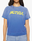 A person wearing The Short Sleeve Concert Tee by Mother, styled with light blue jeans.