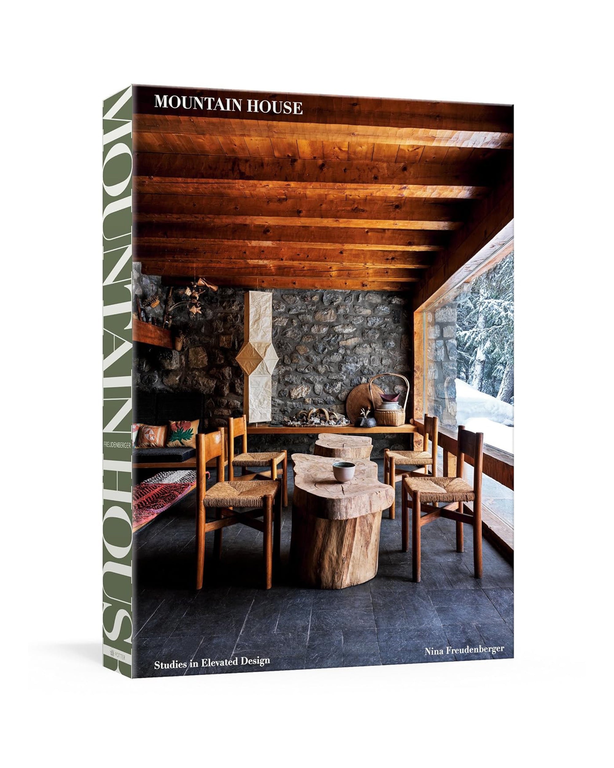 The "Mountain House" book from Random House features a cozy, rustic cover with wooden beams and stone walls, showcasing snowy mountain views and capturing the charm of mountain homes. Author: Nina Freudenberger.