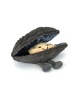 A plush toy clam with a fuzzy grey shell and a smiling beige face inside, plus two grey plush legs—just like the adorable Amuseables Michelle Mussel from Jelly Cat Inc.