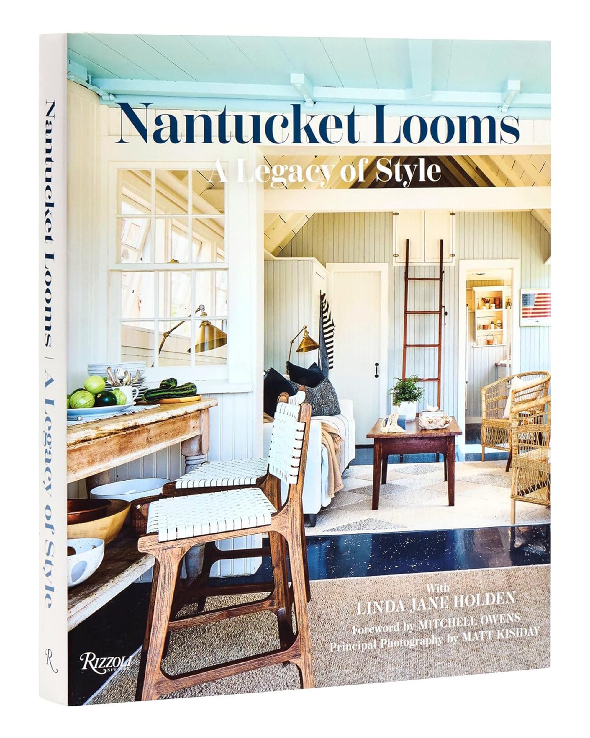 The cover of Nantucket Looms by Random House features a bright, coastal-inspired interior with white walls, a woven chair, wooden table, and fresh green apples on the counter.