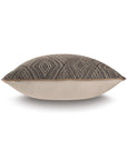 The NAYA DIAMOND WITH SMALL WELT pillow by Eastern Accents features a beige faux leather bottom and a black-and-brown geometric diamond fabric top, shown side view against a white background.