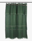 Green linen shower curtain with fringe on a black rod, Libeco Home Nell Piece de Lin Stripe collection.