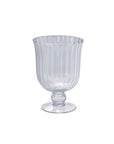 The 32721 Oster Vase M by Accent Decor is a clear glass vase with optic ribbing, wide bowl, short stem, and round base, shown against a plain white background.