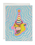 A colorful Faire greeting card featuring a whimsical illustration of a fierce yellow cat wearing a tall, striped party hat, set against a glittery blue and silver wavy background, inspired by the vibrant hues of Scottsdale Arizona.
