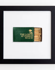 A framed display of a green matchbook with gold lettering that reads "THE LODGE AT PEBBLE BEACH," featuring a partial view of the matches inside. The Match South Art Square Blk Frame is centered against a white background.