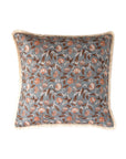 The Faire Block Print Pillow features a square shape, blue background, botanical brown and white floral print, and beige fringe trim—an ideal vintage accent for any living space.