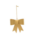 The Accent Decor 13710 Perfect Bow Ornament, featuring two gold ribbon tails, hangs from a thin string against a white background—perfect for holiday decor.