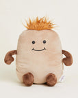 The Faire Potato Warmies is a microwavable plush shaped like a smiling light brown potato with brown limbs and orange spiky hair, offering cozy sensory comfort as it sits upright against a plain background.