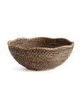 The Burma Rattan Scalloped Bowl by Napa Home & Garden is a large, shallow woven basket with a scalloped edge and checkered natural and dark brown pattern, displaying fine craftsmanship on a white background.