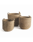The NSG408 Seagrass Round Drum Baskets by Napa Home & Garden come in small, medium, and large sizes with handles. Their woven design adds an organic touch to any space, making them ideal for storage and décor. Displayed on a white background.