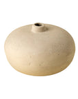 The Indaba Rotunda Paper Mache Vase is a round, flat, beige decorative piece with a small centered opening and smooth unglazed finish—perfect for adding handcrafted charm to any modern interior.