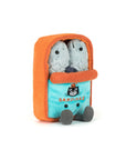 The Amuseables Sardine Tin by Jelly Cat Inc. is a plush toy shaped like an orange and blue sardine can, featuring two gray sardines peeking out, embroidered details, a smiling face, and "SARDINES" on the front.