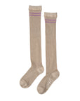 The Unified Shimmer Socks are knee-high beige socks with two horizontal purple stripes near the top, shown laid flat side by side on a white background—ideal for adding a classic touch to any outfit.