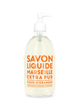 The Liquid Soap 16.7oz by Cie Luxe Brands features a clear glass pump bottle with orange text declaring "Savon Liquide Marseille Extra Pur, Fleur d'Oranger." The label highlights its Provence design, crafted from vegetable oils and made in France.