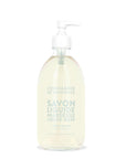 A sleek glass pump bottle holds Cie Luxe Brands' Liquid Soap 16.7oz, labeled "Savon Liquide Marseille Liquid Soap, Jasmin Delicat Soft Jasmine." Crafted with nourishing vegetable oils, it has a delicate pale yellow hue.