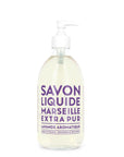 A 16.7oz clear glass pump bottle from Cie Luxe Brands contains liquid soap labeled "Savon Liquide Marseille Extra Pur, Lavande Aromatique" in elegant purple text. Crafted with nourishing vegetable oils, this aromatic lavender soap is made in France and designed in Provence.
