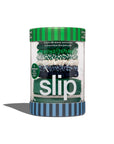 A clear cylindrical container with a green and blue striped lid and base holds six silk Hair On Point Skinny Scrunchies by Faire in green, blue, and white—premium anti-breakage hair accessories packed in a pouch.
