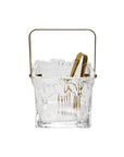 The Creative Co-op Glass Ice Bucket with Tongs features a textured design, gold metal handle, and matching gold tongs, adding elegance to your entertaining essentials.
