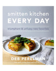 The cover of "Smitten Kitchen Every Day" by Random House shows golden potatoes topped with greens on a white surface. This cookbook offers simple recipes for tasty everyday meals.