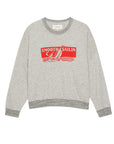 The Great Inc. Smooth Sailin Sweatshirt is a light gray crewneck with dark gray collar, cuffs, and hem. A red sailboat seascape and “Smooth Sailin” in white add vintage-inspired flair to the front.