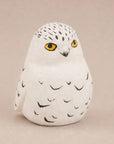 Hand-carved songbird figurine by The Faire, ideal for nature-themed décor or gifts from Bungalow Furniture & Accessories.