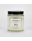 A glass jar candle with a black lid labeled "Austin Press Travel Candle" features gold accents, "Austin Press SF," and contains white botanical waxes for an all-natural experience. Brand: Faire.