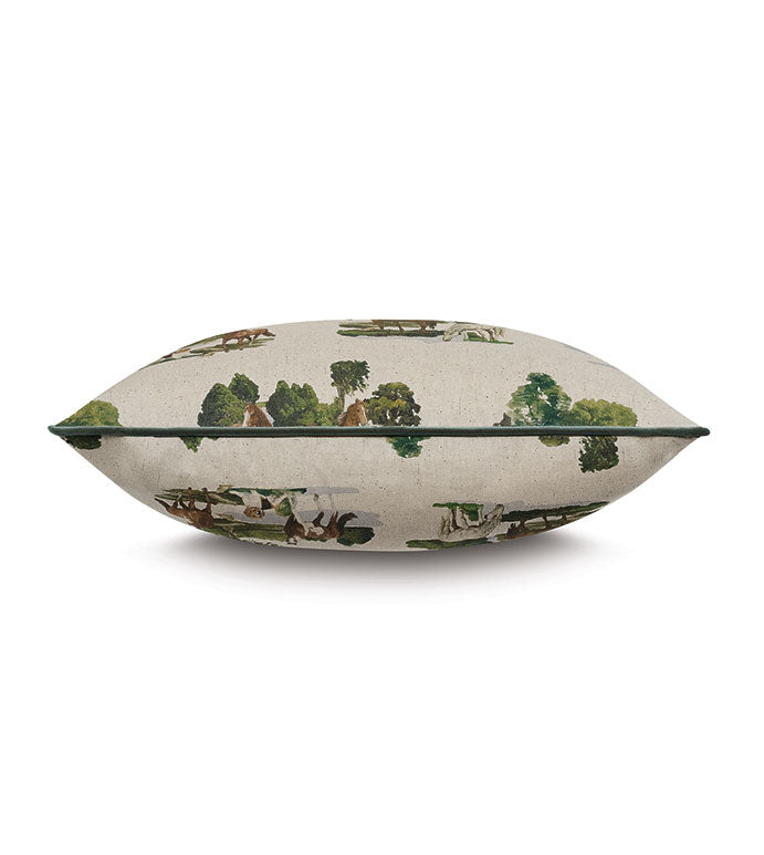 The Colburn Country decorative pillow from Eastern Accents features a scenic countryside print with trees, greenery, and houses. Shown side view on a plain white background, it includes an invisible zipper for a seamless finish.