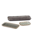 Three 95000 Starling Trays by Accent Decor, featuring textured ceramic surfaces in dark gray, green, and light brown, are displayed on a white background.