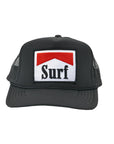 The SURF Trucker Hat by Hype Factory Inc. is a black mesh cap with an embroidered front patch showcasing a red chevron above "Surf" in bold black letters on a white background.