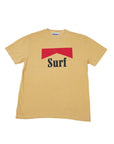 The SURF Tshirt by Hype Factory Inc. is a beige 100% cotton unisex tee featuring a red geometric shape above bold black "Surf" text on the front, displayed flat on a white background.