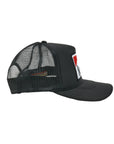 The SURF Trucker Hat by Hype Factory Inc. is a black mesh cap with a flat bill and an embroidered red and white rectangular patch up front. Its side view shows the breathable mesh and adjustable fit for all-day comfort.