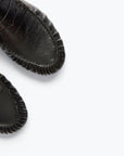 Close-up of the front portions of Freda Salvador's Sydney Crinkle Loafer, showcasing detailed toe stitching on Italian leather against a plain white background.
