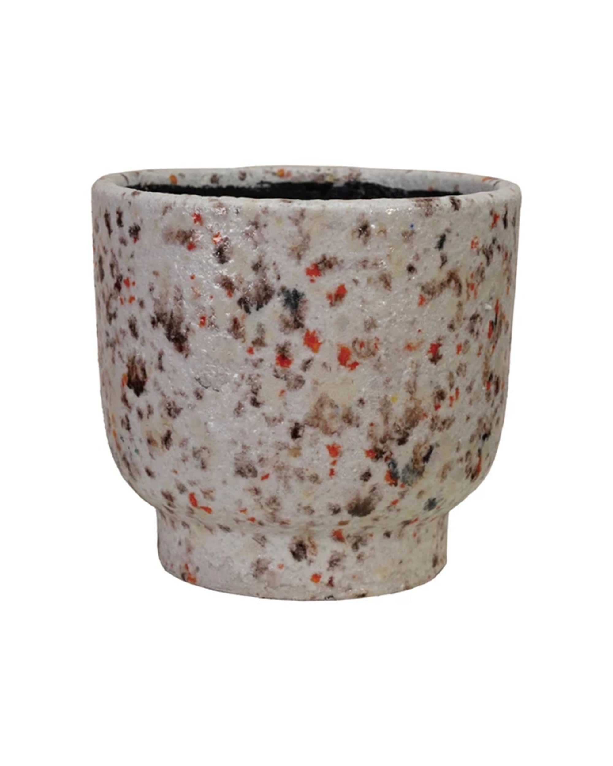 The Creative Co-op Terra-cotta Terrazzo Planter features a rounded body, short base, and a textured, speckled surface in white, black, and orange, giving it a rustic, multi-color look with a slightly rough, uneven finish.