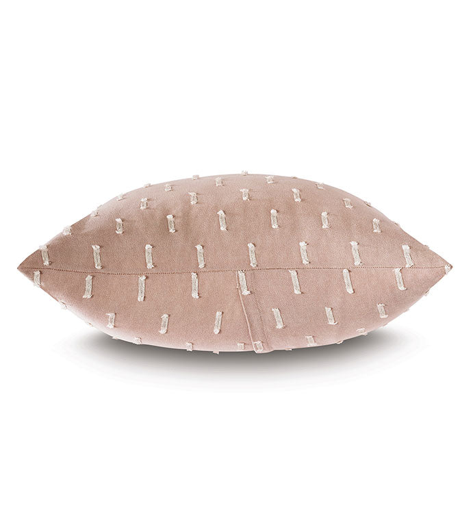 A decorative pink Bluff Euro 27x27" pillow by Eastern Accents with a pattern of white vertical lines against a white background. The pillow, embodying Arizona style, is shaped like a horizontal ellipse with pinched edges.
