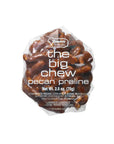 A clear plastic package labeled "Faire LC Praline Big Chews 2.5oz" contains large pecan praline pieces, with ingredients and weight (2.5 oz) displayed on the front.