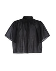 The Hayden Shirt by THE SHIRT is a black, short-sleeve, button-up sheer blouse with a collar and loose fit, made from lightweight cotton voile, shown on a white background.
