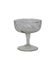 The DG1045 Twisted Stemmed Coupe Glass by Creative Co-op features clear hand-blown glass with a wavy pattern, wide bowl, and short twisted stem on a round base, set against a white background.