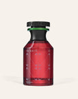 A red glass bottle with a black cap and green accent, labeled "The Nue Co" and "Pheremone Fragrance 50ml," showcases a modern, minimalist design. This musky scent stands on a light beige background.
