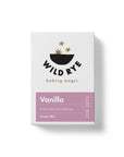 A white box of Wild Rye Cake Mix in classic vanilla flavor, featuring a black bowl with golden stars and a purple label marked "Vanilla" and "Classic Mix," made with smooth Madagascar vanilla.