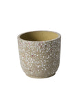 The Accent Decor 58187 Verde Pot is a round, neutral terrazzo planter with a beige base and white and pink speckles, featuring a smooth finish and wide open top, displayed against a plain white background.