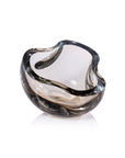 The Zodax CH-7877 Viento Glass Bowl is a modern clear glass piece featuring organic curves and a thick, smooth rim, displayed on a white background.