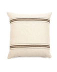 The Vourkari Pillow by Libeco Home is a square, cream cushion with two brown stripes on top and bottom and a handy zipper closure, shown on a white background.