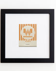 A framed Match South Art Square Blk Frame is centered within a white mat and black frame. The matchbook features the Whataburger logo with orange and white stripes and text reading "Whataburger" and "San Antonio, TX." The frame, protected by clear acrylic, is hung on a plain white wall.
