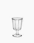The Surface Glassware goblet by Serax is a clear, vertically ribbed designer piece featuring a short stem and wide base, shown against a plain white background.