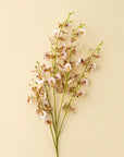 The Faire Wild Orchid Spray features three long green stems with delicate pale pink faux flowers and green buds, elegantly arranged against a beige background—ideal for elevating your home decor.