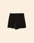 The Shayden Short by Xirena is a black terry cloth sweat short made from a soft cotton blend, featuring an elasticized waist and front patch pocket. Shown against a plain beige background.